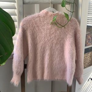 Very soft feather pink sweater.